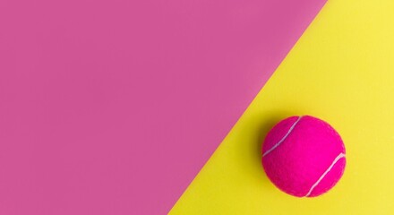 Bright Tennis Ball on Contrasting Pink and Yellow Background, Sports and Recreation Theme