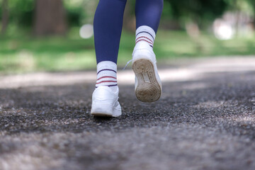 Person walking on path practicing outdoor exercise