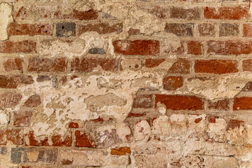 Cistercian Abbey Lubiaz in Poland. An old red brick wall with crumbling plaster. lubiaz Abbey.