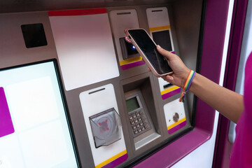 Person paying for subway ticket using NFC smartphone