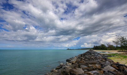 Rocky shoreline with a body of water in the background