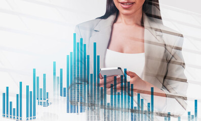 Confident businesswoman in a light blazer using smartphone, overlaid with blue financial bar charts, on bright office background, concept of business growth