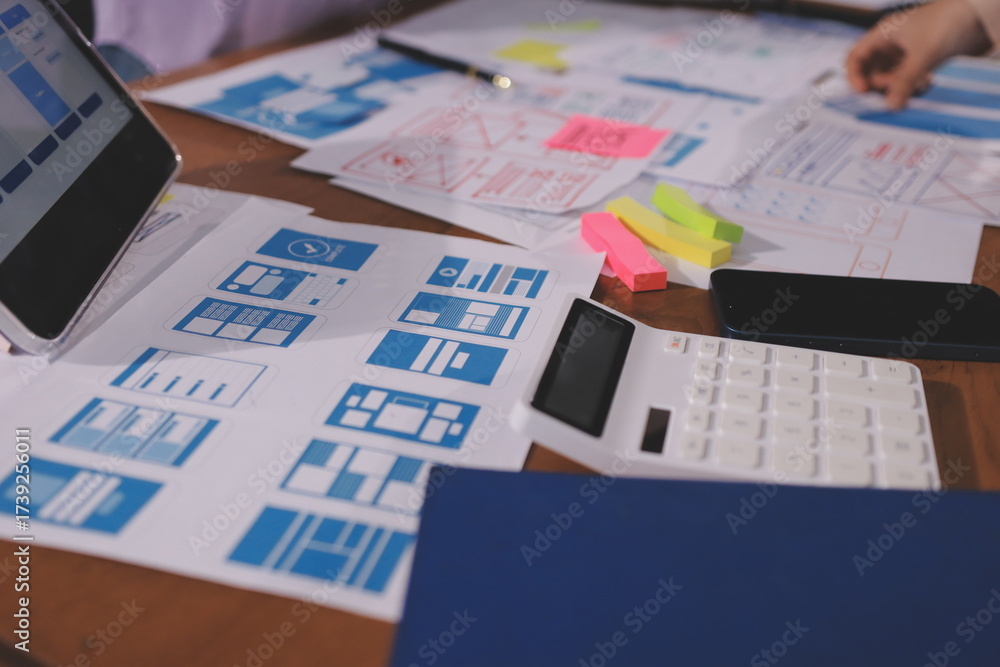 Wall mural close up ux developer and ui designer brainstorming about mobile app interface wireframe design on t