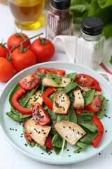 Tasty salad with eryngium mushrooms served on white table, closeup
