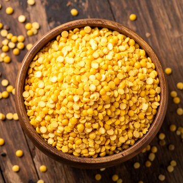 Yellow split peas in a wooden bowl
