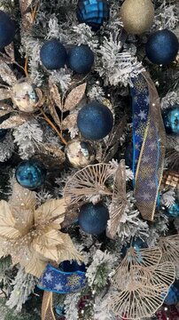 4k footage close up of lighted Christmas tree ornaments and decorations. Mistletoe, baubles, and bell with Interactive sparkling christmas twinkle lights or icicle lights.