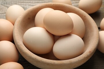 Fresh raw chicken eggs on table, closeup