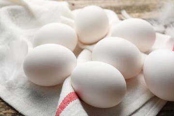 Fresh raw chicken eggs on table, closeup