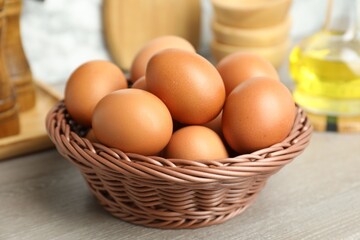 Raw chicken eggs on wooden counter, closeup