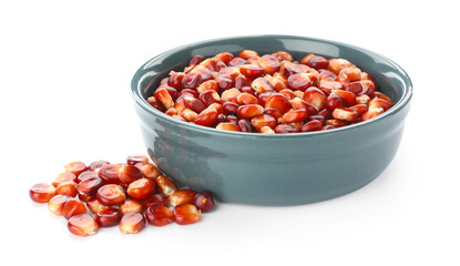 Ripe red corn kernels and bowl isolated on white