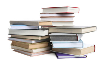 Stacks of many books isolated on white