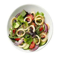 Delicious salad with squid rings, nuts and vegetables in bowl isolated on white, top view