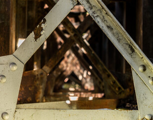 abstract composition of the metal structure of an old bridge