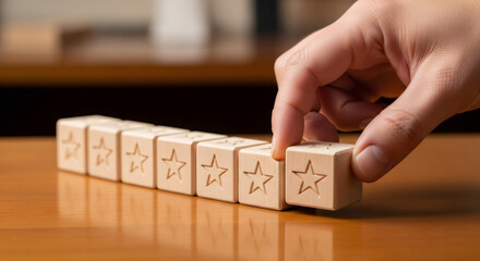 Hand of a man picking up the last wooden star block. Customer service rating concept. Quality assessment and feedback for reputation.