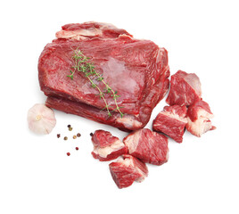 Pieces of raw beef meat and spices isolated on white, top view