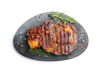 Delicious grilled beef steak with herbs and spices isolated on white, top view
