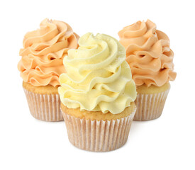 Delicious cupcakes with colorful cream isolated on white