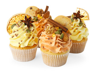 Delicious cupcakes with sprinkles, cookies, nuts and spices isolated on white. Autumn atmosphere