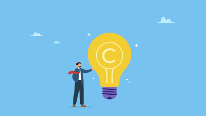 Businessman holding light bulb idea with copyright symbol. Copyright reserved, trademark intellectual property protection, original idea or innovation, legal or law protection registered.
