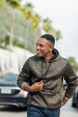 Fototapeta premium Charming african american man enjoys a sunny autumn day in vibrant Miami