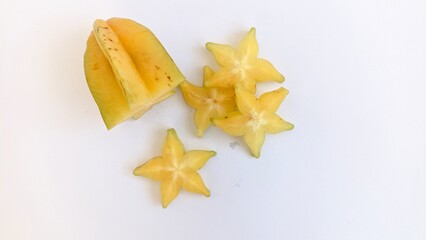 Fototapeta premium sliced ripe yellow starfruit in white background