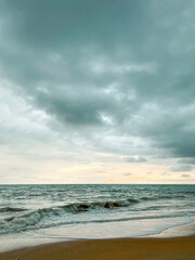 Dramatic Sunset: Sea Under Stormy Clouds