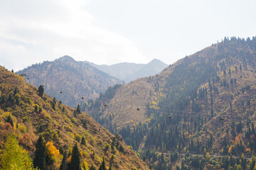 Gondola line traversing beautiful autumn mountain slopes