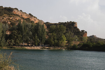 Ruidera Lagoons lake with camping area and people kayaking
