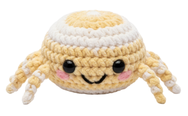 a cute yellow crocheted spider with a smiling face