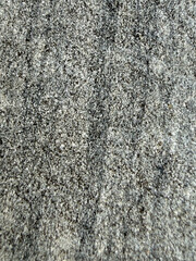 Close-up view of rough and textured gray surface