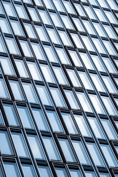 Grid glass facade with repeated pattern emphasizing rhythm, balance and contemporary urban design