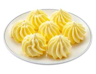 Swirled, fluffy, yellow desserts arranged neatly on a white plate
