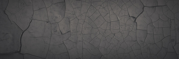Dark wide panoramic background. Peeling paint on a concrete wall. Faded dark texture of old cracked...
