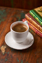 Cup of coffee on rustic wooden background. Soft focus. Copy space	