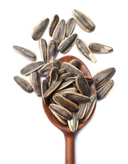 Sunflower seeds in spoon isolated on white, top view