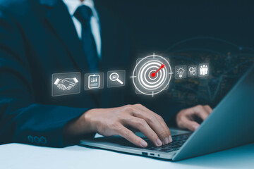 Businessman using laptop with digital marketing strategy icons, target audience, data analysis, and innovation concept for business growth and success in modern technology.