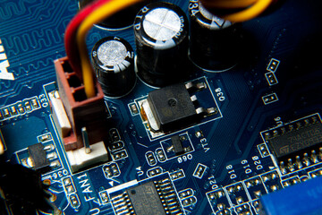 Close-up of an assembled electronic printed circuit board with slots and connectors
