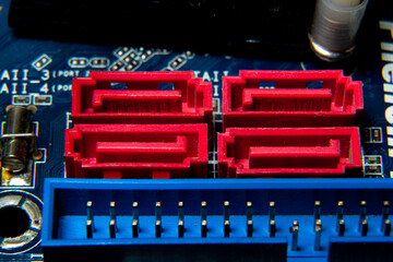 Close-up of an assembled electronic printed circuit board with slots and connectors