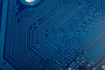 A close-up of a fragment of a blue electronic circuit board