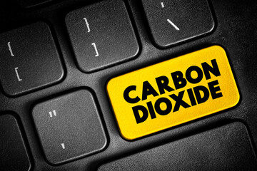 Fototapeta premium Carbon Dioxide is a chemical compound made up of molecules that each have one carbon atom covalently double bonded to two oxygen atoms, text button on keyboard, concept background