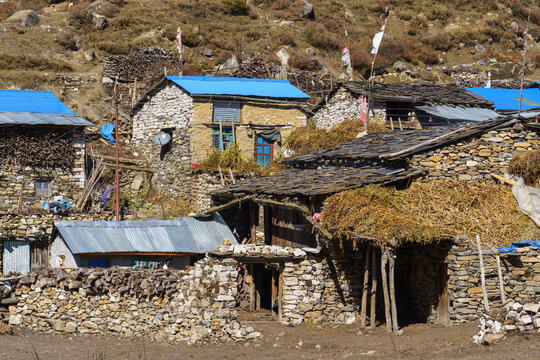 Mountain village with blue roofs in Manang, Nepal