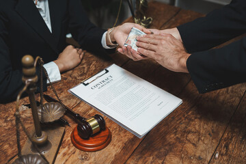 Person taking money over contract and legal items
