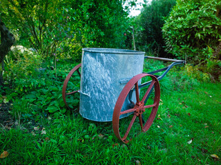 A Victorian water bowser,or water bodge, in an English garden