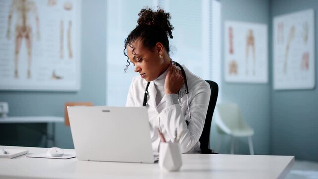 Woman Using Computer With Bad Posture In Chair
