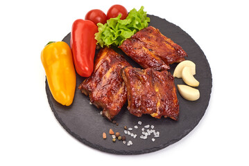 Barbecue Ribs, Peppers, Tomatoes on Slate, isolated on white background