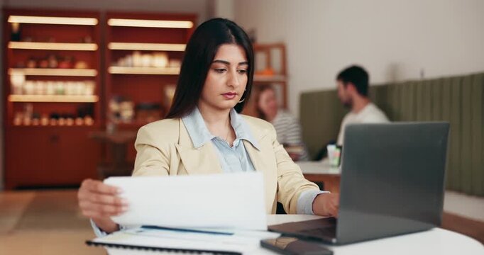 Business, woman and typing in restaurant with laptop, research and data analysis for company. Online, entrepreneur and tech in cafe with documents, review and information processing for evaluation. - Powered by Adobe