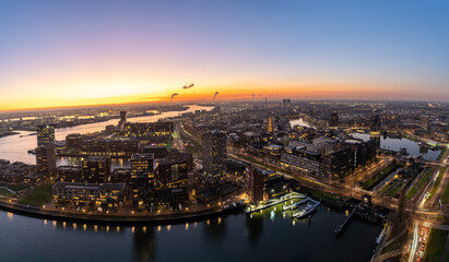 City lights glow under a fading twilight sky