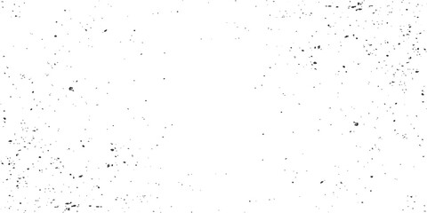 Grungy black ink splat and paint splashes on a textured old paper surface creating a messy pattern