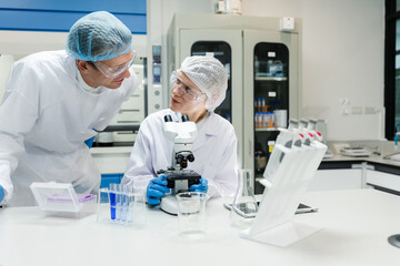 Scientists discussing research in modern laboratory.