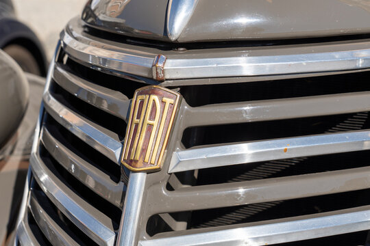 Close up of vintage Fiat brand logo on old car in exhibition during a vintage car rally in Varallo Sesia, Italy, September 29, 2025